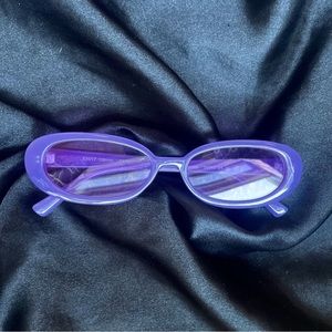 Tilly’s Purple Oval Framed Sunglasses.
